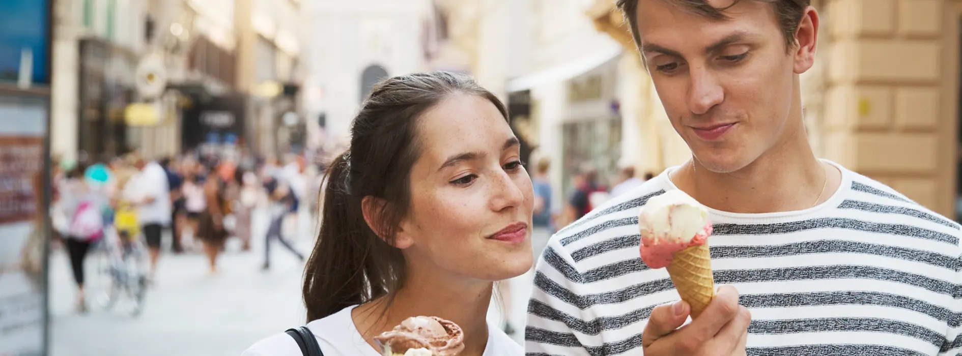 Strolling around in the Old City, couple eating ice cream
