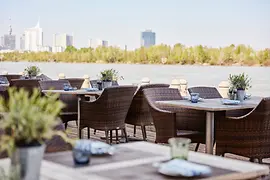 Terrace with tables by the Danube