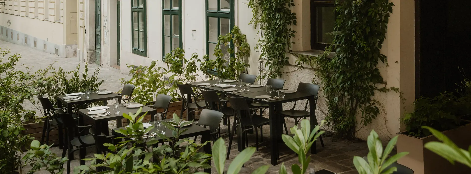 Outdoor dining area at TIAN Bistro restaurant on Spittelberg